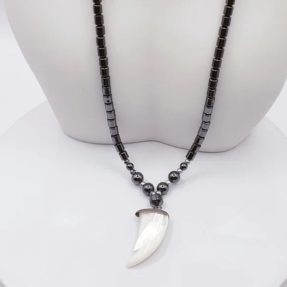 Hematite With Carved Mother Of Pearl Ivory Claw Pendant Necklace